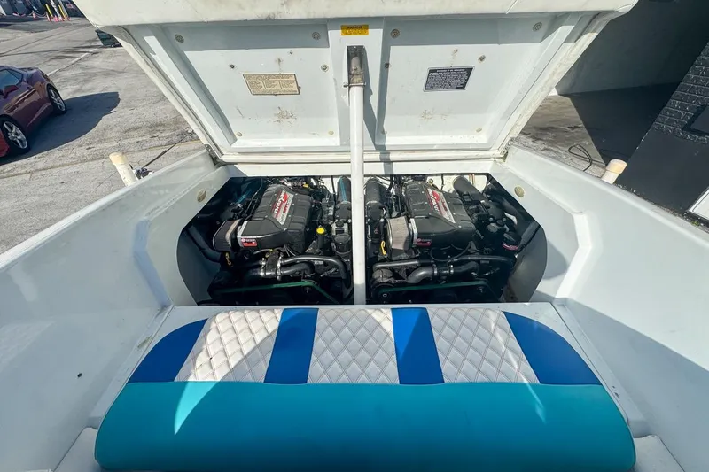 Slide: The Image of Engine compartment of a 1999 Baja 29 Outlaw boat with open hatch. - 66