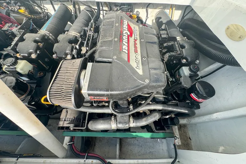 Slide: The Image of 1999 Baja 29 Outlaw engine compartment with MerCruiser 454 MPI engine. - 71