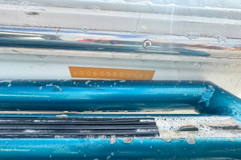 Slide: The Image of 1999 Baja 29 Outlaw boat with visible serial number plate. - 77