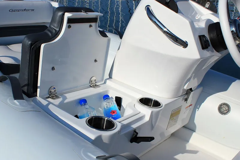 Slide: The Image of Manufacturer Provided Image: Walker Bay Generation 10 LTE 2025 boat interior with storage and cup holders. - 9