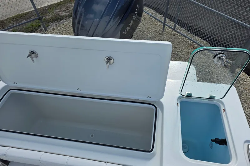 Slide: The Image of Open storage compartments on a 2026 Parker 227 Explorer boat, showcasing utility and design. - 13