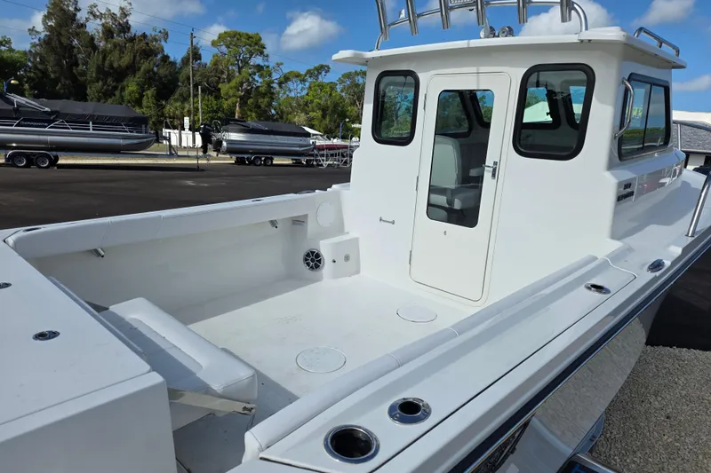 Slide: The Image of 2026 Parker 227 Explorer boat with spacious deck and modern cabin design. - 6