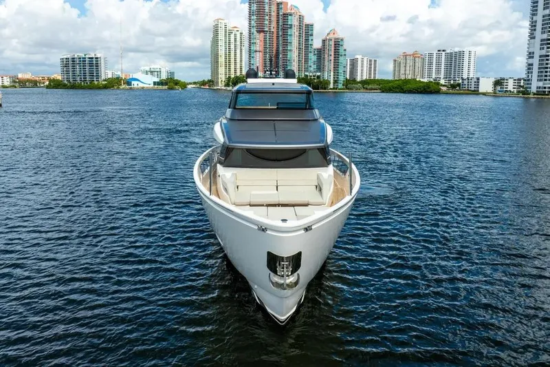 Slide: The Image of Sanlorenzo SX76 2021 yacht on water with city skyline background. - 2