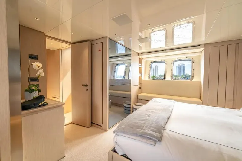 Slide: The Image of Luxurious Sanlorenzo SX76 2021 yacht bedroom with modern design and large windows. - 36