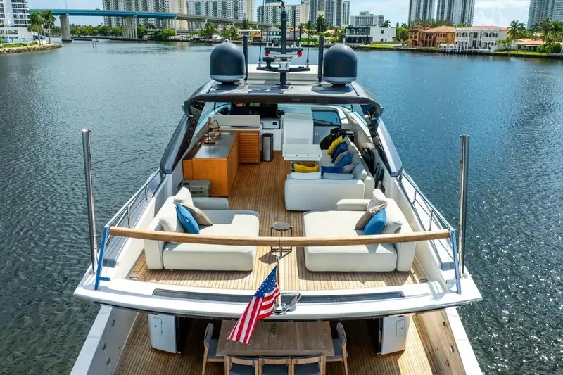 Slide: The Image of Luxurious 2021 Sanlorenzo SX76 yacht with spacious deck and modern seating on a serene waterway. - 6