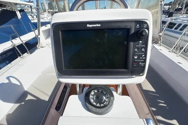 Slide: The Image of Cockpit of 2016 Catalina 385 sailboat with Raymarine navigation system and compass. - 25
