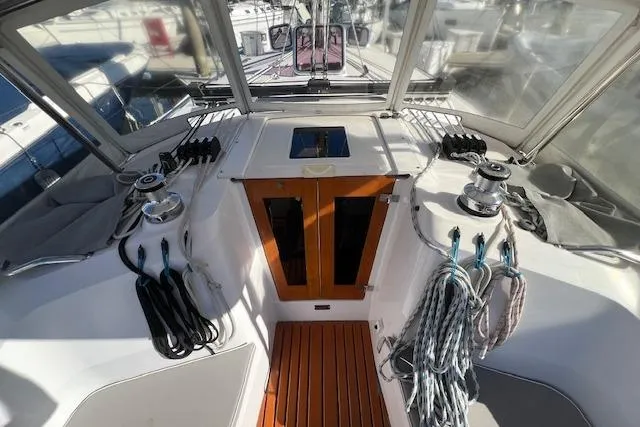 Slide: The Image of Cockpit of 2016 Catalina 385 sailboat with winches and ropes, showcasing sleek design. - 27