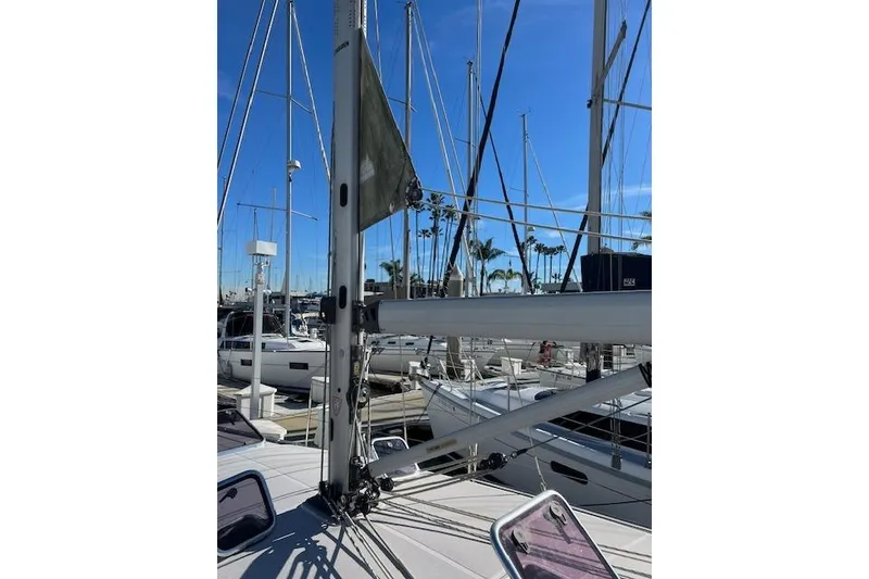 Slide: The Image of 2016 Catalina 385 sailboat mast and rigging at marina under clear blue sky. - 29