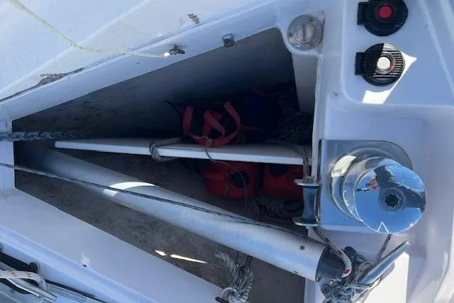Slide: The Image of Storage compartment on a 2016 Catalina 385 sailboat with equipment and life jackets. - 32