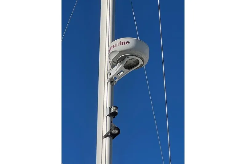 Slide: The Image of Sailboat mast with radar equipment on a 2016 Catalina 385 against clear blue sky. - 35