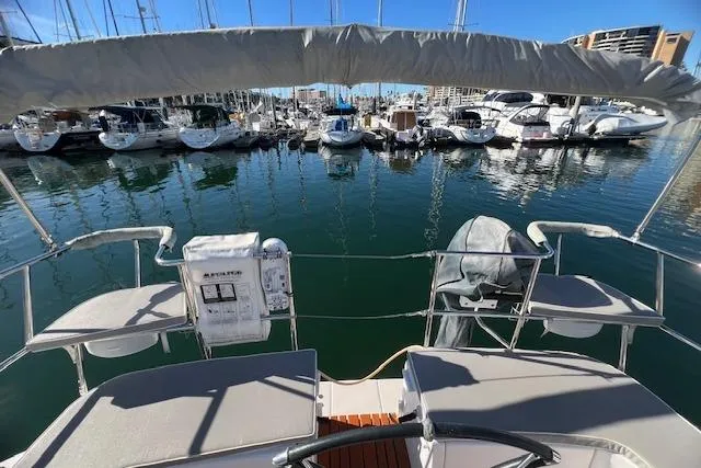 Slide: The Image of Catalina 385 sailboat, 2016 model, docked in a marina with other boats. - 39