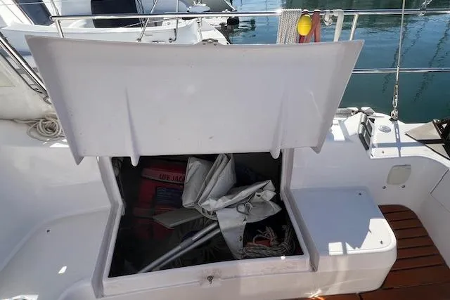 Slide: The Image of Open storage compartment on 2016 Catalina 385 sailboat, containing ropes and equipment. - 42