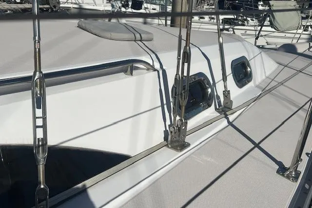 Slide: The Image of 2016 Catalina 385 sailboat deck with rigging and hatches in sunlight. - 44