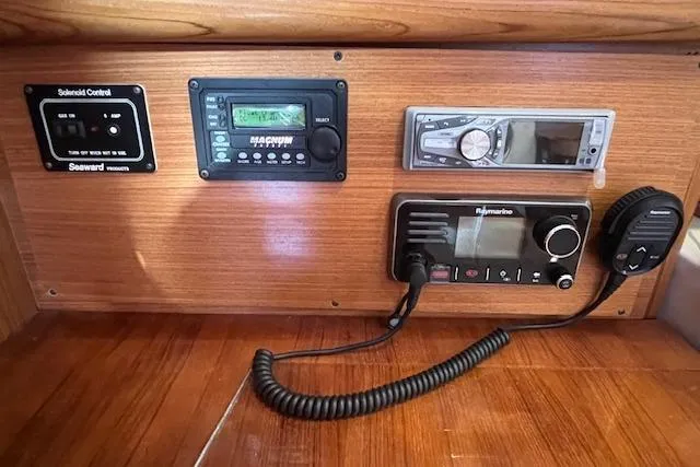 Slide: The Image of Control panel of a 2016 Catalina 385 sailboat with radio and navigation equipment. - 8