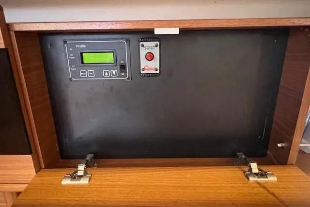 Slide: The Image of Control panel inside a 2016 Catalina 385 sailboat cabinet. - 9