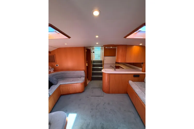 Slide: The Image of Luxurious interior of 2006 Dixon 52 yacht with cozy seating and modern kitchen. - 5