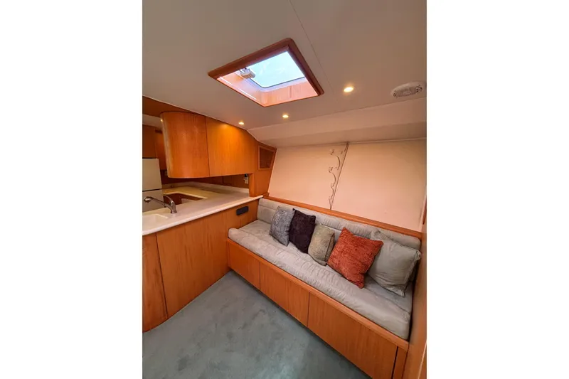 Slide: The Image of 2006 Dixon 52 yacht interior with cozy seating and skylight. - 7