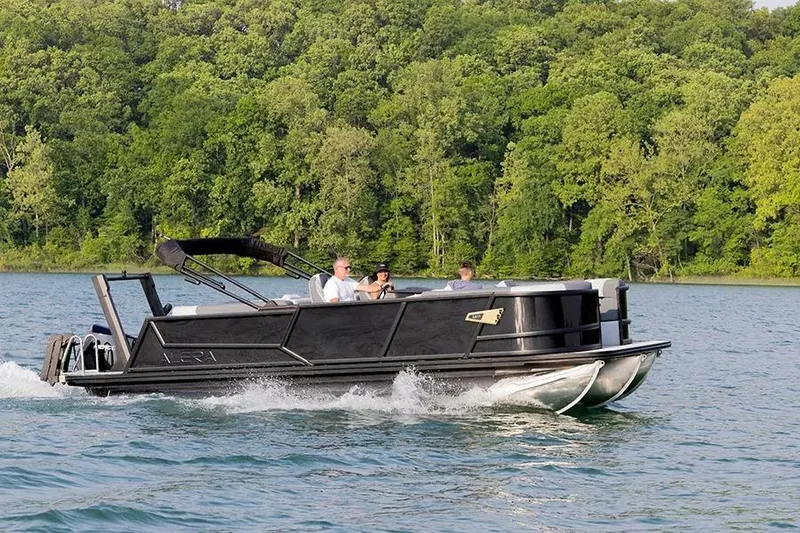 The Image of 2026 Alera M 23L pontoon boat on trailer, parked outdoors. - 0