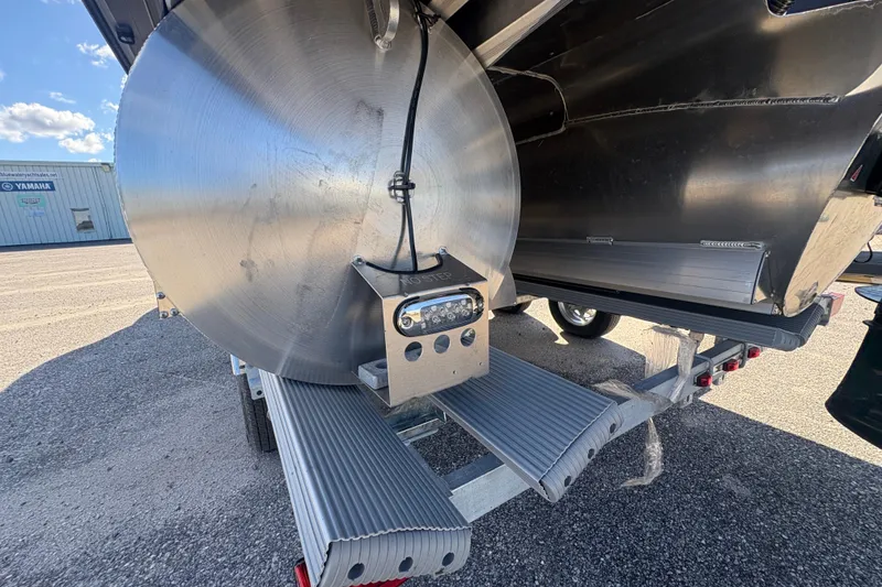 Slide: The Image of Alera M 23L 2026 boat trailer with aluminum components in a parking lot. - 12