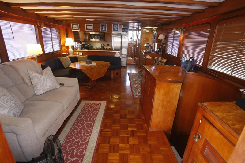 Slide: The Image of Luxurious interior of 1982 DeFever 52 Offshore Cruiser with wood finishes and cozy seating. - 23