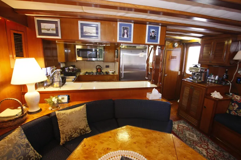 Slide: The Image of Interior of 1982 DeFever 52 Offshore Cruiser with cozy seating and kitchen area. - 30