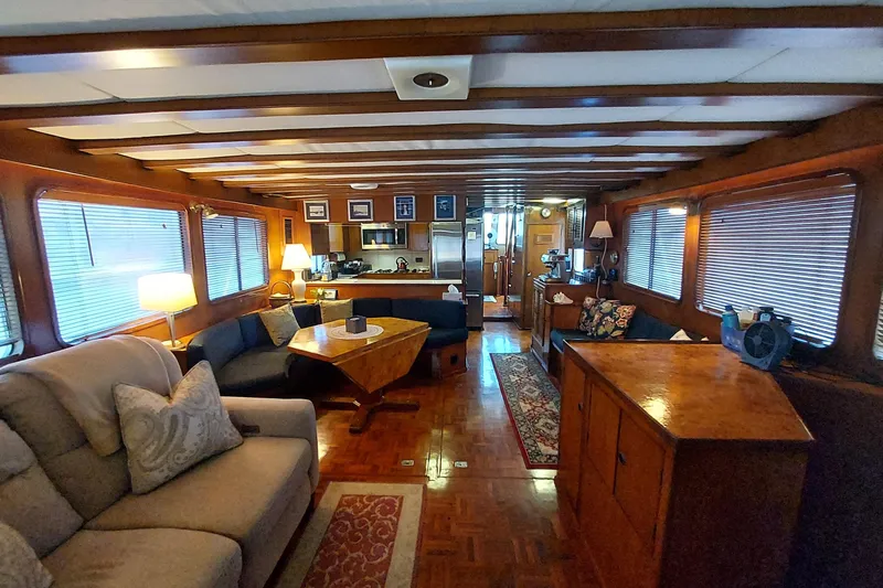 Slide: The Image of Interior of 1982 DeFever 52 Offshore Cruiser with cozy seating and wooden decor. - 32