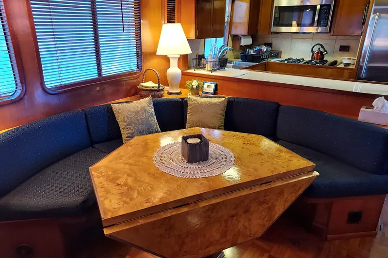 Slide: The Image of Interior of 1982 DeFever 52 Offshore Cruiser with cozy dining area and kitchen. - 34