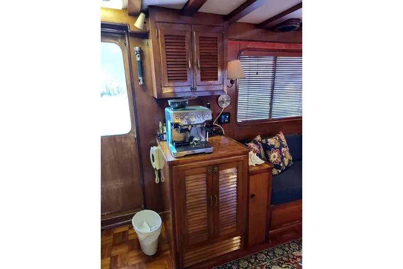Slide: The Image of Interior of 1982 DeFever 52 Offshore Cruiser with coffee maker and wooden cabinetry. - 44
