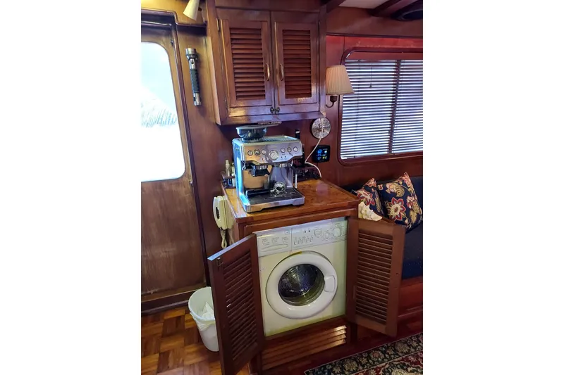 Slide: The Image of Interior of 1982 DeFever 52 Offshore Cruiser with coffee machine and washing machine. - 45