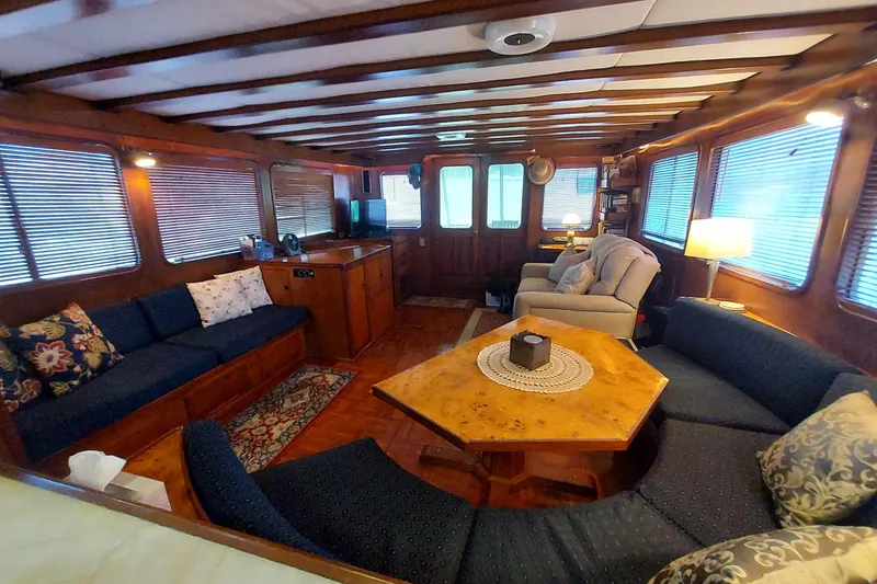 Slide: The Image of Luxurious interior of 1982 DeFever 52 Offshore Cruiser with cozy seating and elegant decor. - 46
