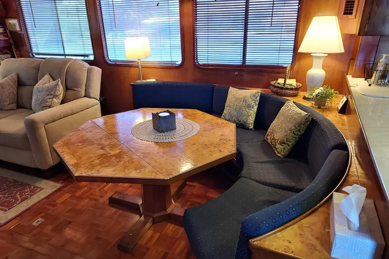 Slide: The Image of Interior of 1982 DeFever 52 Offshore Cruiser with cozy seating and wooden table. - 47