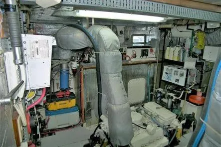 Slide: The Image of Engine room of 1982 DeFever 52 Offshore Cruiser with visible machinery and equipment. - 65