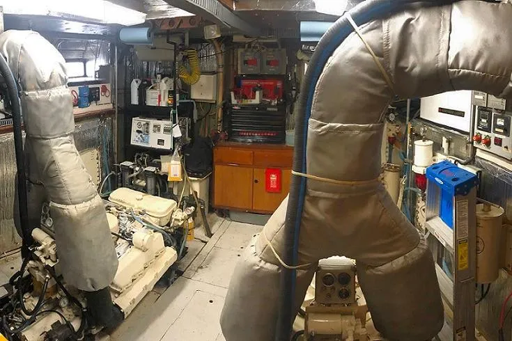 Slide: The Image of Engine room of 1982 DeFever 52 Offshore Cruiser with machinery and equipment. - 66