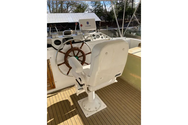Slide: The Image of Captain's chair and helm of 1982 DeFever 52 Offshore Cruiser yacht. - 72