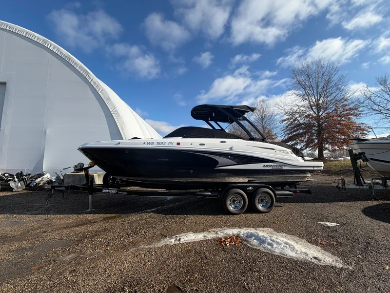 The Image of 2023 Monterey M6 boat on trailer, blue sky. - 0