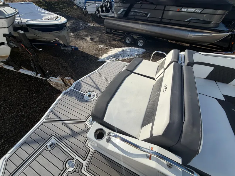 Slide: The Image of 2023 Monterey M6 boat with luxurious outdoor seating area. - 12