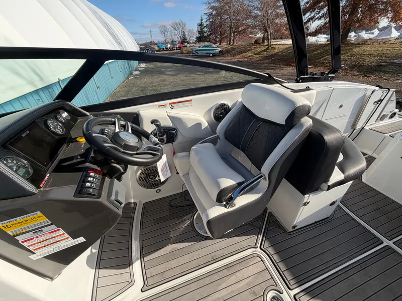 Slide: The Image of Interior of a 2023 Monterey M6 boat with steering console. - 18