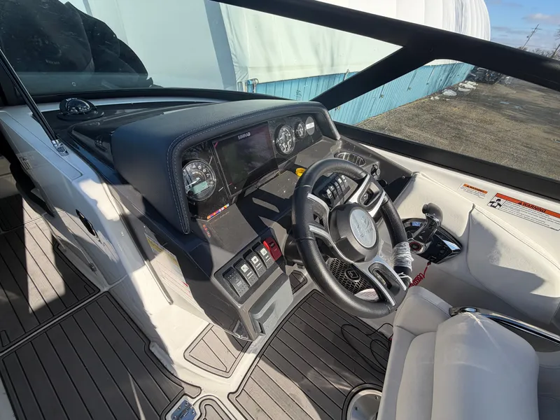 Slide: The Image of Interior view of 2023 Monterey M6 boat cockpit with controls. - 19