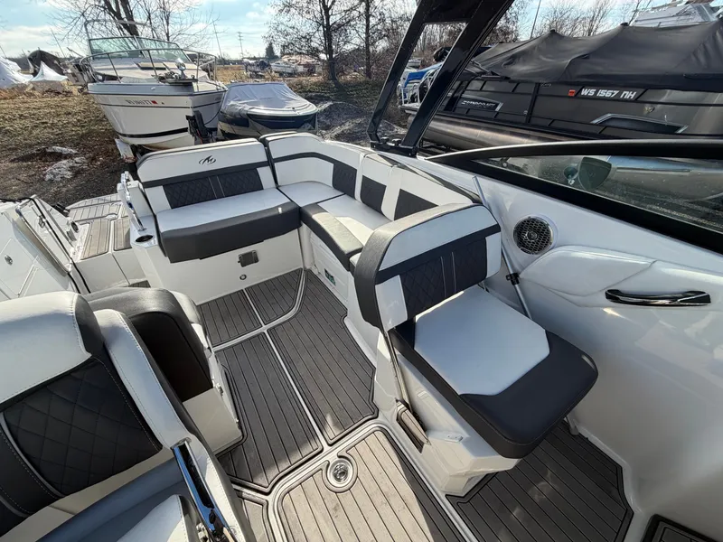 Slide: The Image of Interior of a 2023 Monterey M6 boat with luxurious seating. - 25