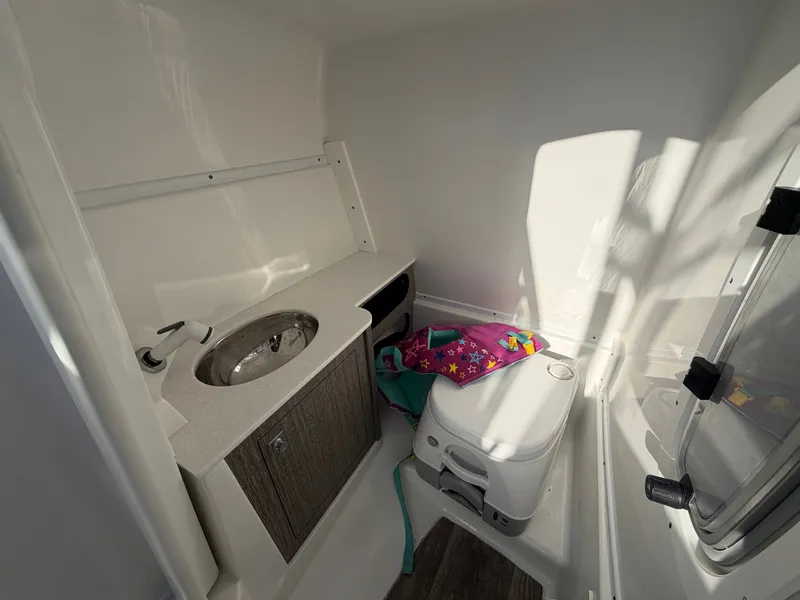 Slide: The Image of Interior of 2023 Monterey M6 boat with sink and toilet. - 31