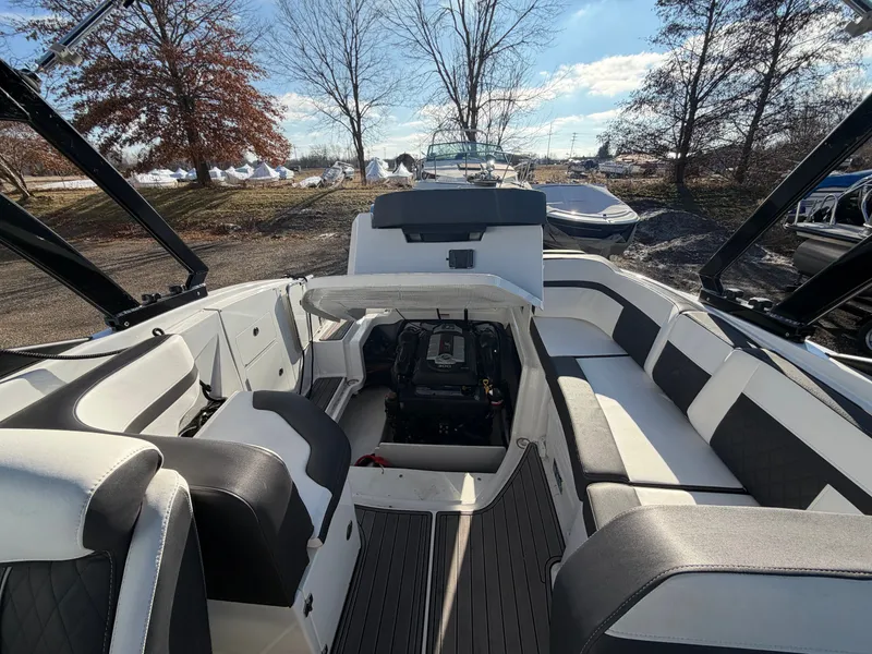 Slide: The Image of 2023 Monterey M6 boat with open engine compartment, stylish interior. - 34