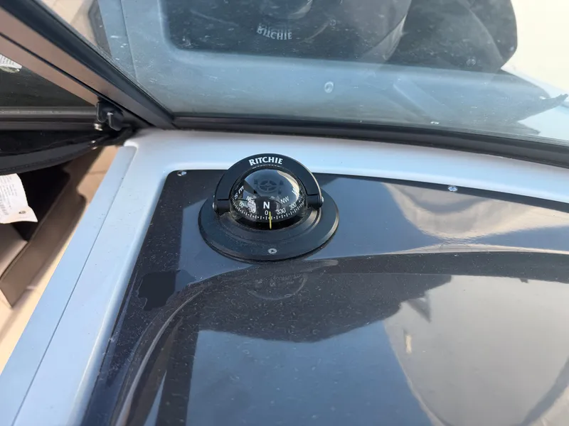 Slide: The Image of Compass on a 2023 Monterey M6 boat. - 38