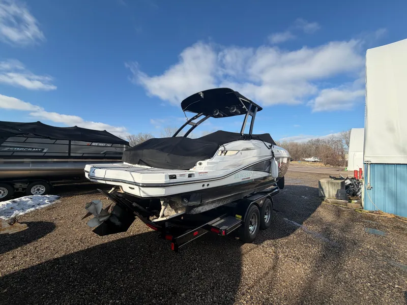 Slide: The Image of 2023 Monterey M6 boat on trailer under blue sky. - 4