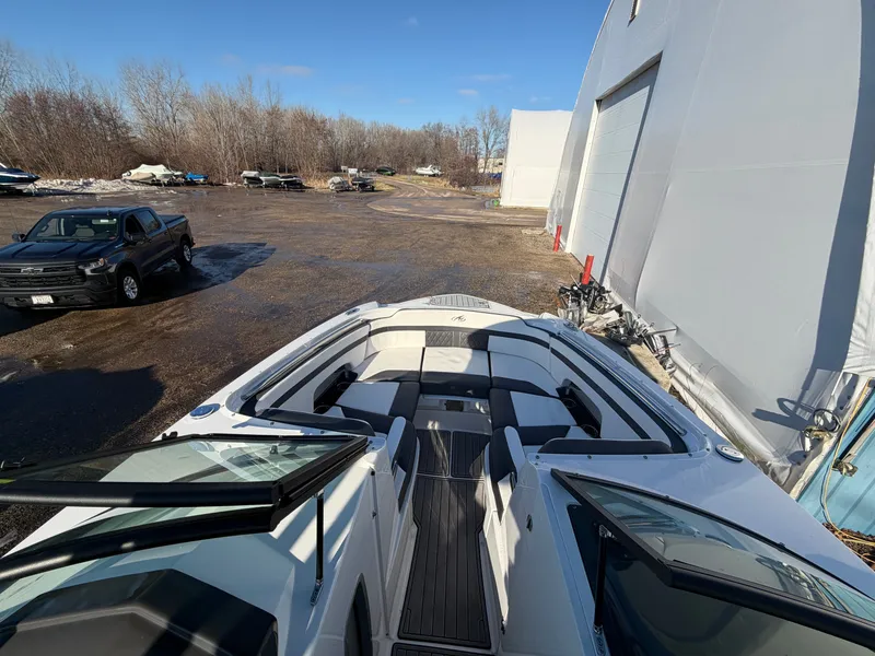 Slide: The Image of 2023 Monterey M6 boat outdoors in sunny weather. - 40