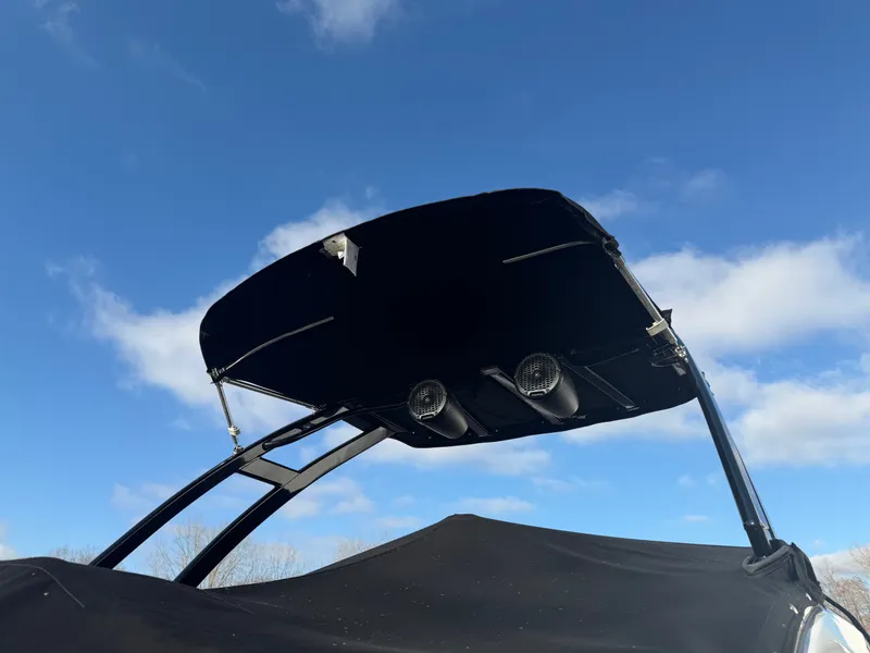 Slide: The Image of 2023 Monterey M6 boat with speakers and blue sky. - 7