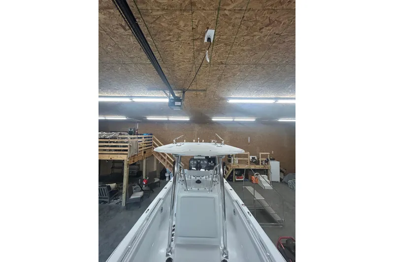 Slide: The Image of 2024 Contender 24 Sport boat in a workshop, viewed from above. - 28