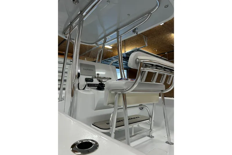 Slide: The Image of 2024 Contender 24 Sport boat interior with Garmin equipment and sleek seating design. - 36