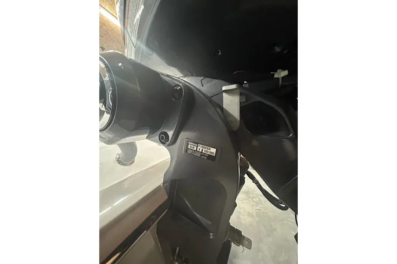 Slide: The Image of Close-up of a 2024 Contender 24 Sport boat engine component. - 6