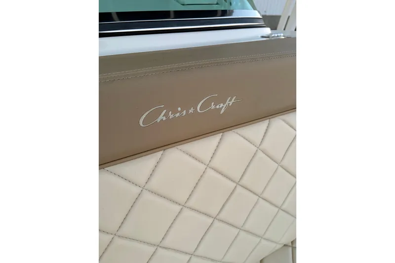 Slide: The Image of 2019 Chris-Craft Catalina 26 interior with quilted leather and logo detail. - 12