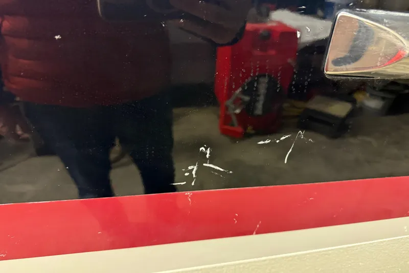 Slide: The Image of 2019 Chris-Craft Catalina 26 with visible scratches on the surface. - 14